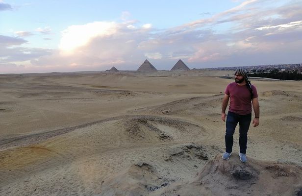 Sunset at Giza pyramids by camel