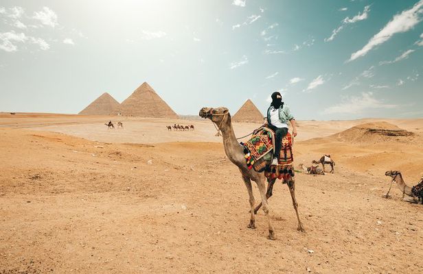 Camel Ride at Giza Pyramids during sunset