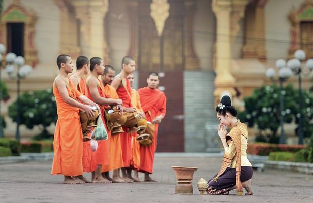 Sunrise blessing walk towards famous temple with fruit and flower donation 