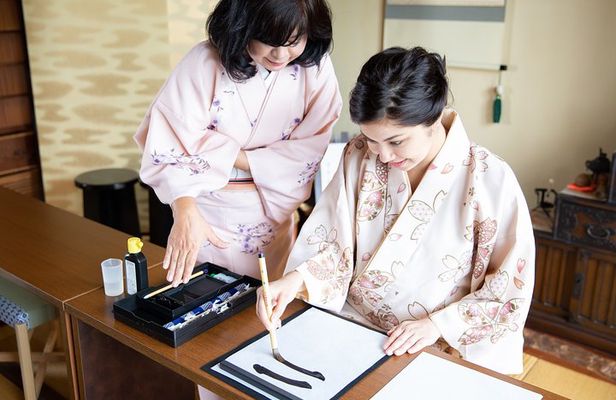 Calligraphy experience with simple kimono in Okinawa