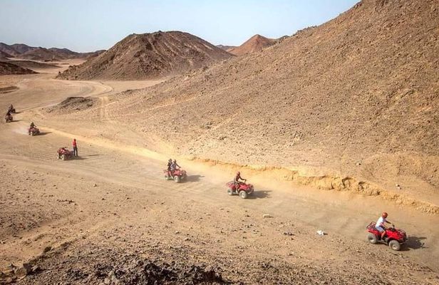 Sunset Desert Safari Trip by Quad Bike with Camel Ride and Bedouin Dinner