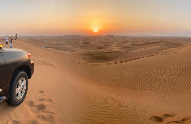 Private Desert Excursion with camel ride Sandboard & BBQ Dinner