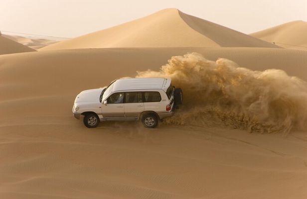 Morning Desert Safari plus Quad Bike, Sandboard and Camel ride