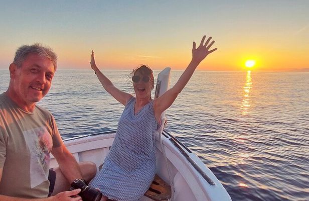 Cinque Terre sunset boat tour with a traditional ligurian gozzo