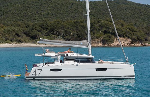 Semi-Private Brand-New Catamaran Cruise in Mykonos with Meal, Drinks & Transport