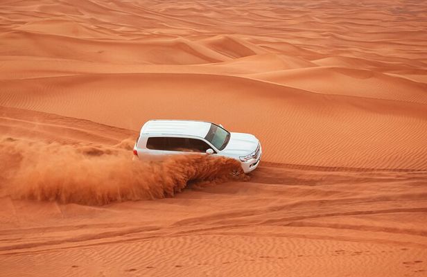Dubai Desert Safari Dune Bashing, Camel Ride, Sand Boarding, BBQ Dinner.