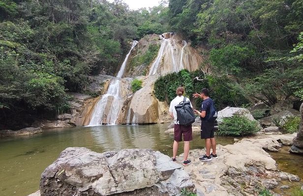 Natural adventure with waterfalls, trails and sunny day