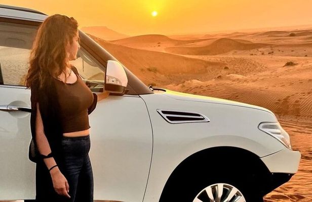 Evening Desert Safari with BBQ Dinner, Sandboarding and Camel Ride Experience