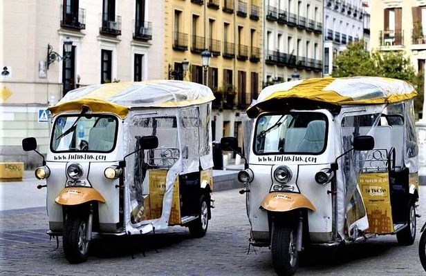 Tour of Historic and Modern Madrid with a guide in a yellow tuk tuk
