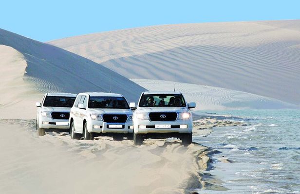 From Doha Airport: Desert safari and Inland Sea Tour.