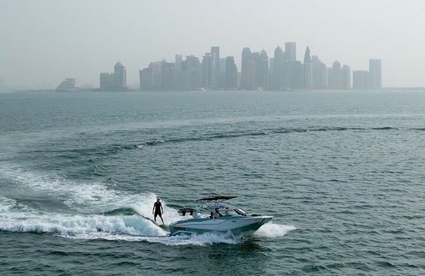 Private Wakesurfing or Wakeboarding along Doha's skyline