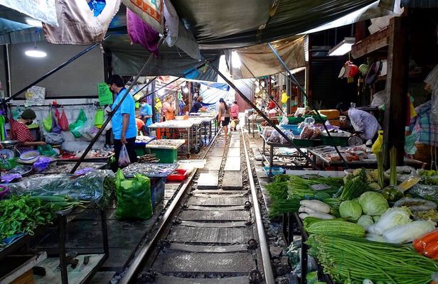 Meet Thai locals and tour Maeklong Railway Market with lunch