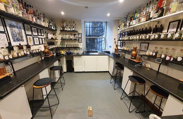 Distill a bottle of gin on mini copper stills