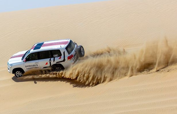 Full-day Qatar desert safari: dune bashing, sandboarding, camels