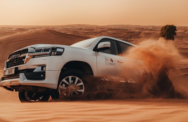 Deluxe Sunset Desert Safari: SandSurfing, Camel Ride & BBQ dinner