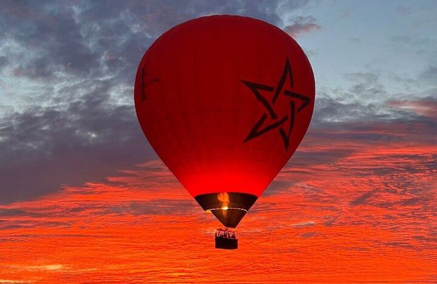 Hot air balloon flight in the desert with camel ride