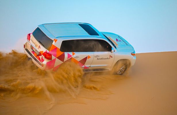 Abu Dhabi Evening Desert Safari - Dune bashing Camel ride and BBQ