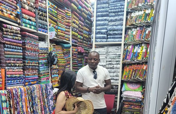 African custom clothing making experience with fabric tour