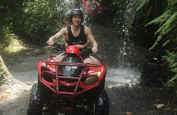 ATV Quad Bike Through Tunnel and Waterfall