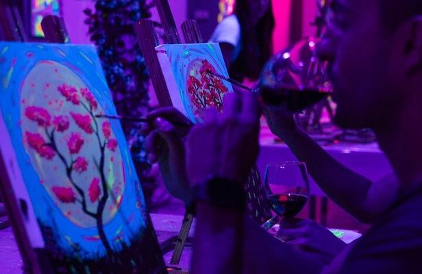 Paint a neon fluorescent picture while drinking unlimited wine