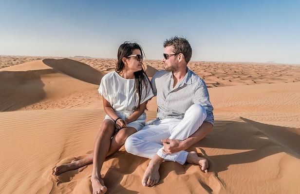 Dubai Red Dune Safari with Camel Ride, Sandboarding & BBQ Dinner