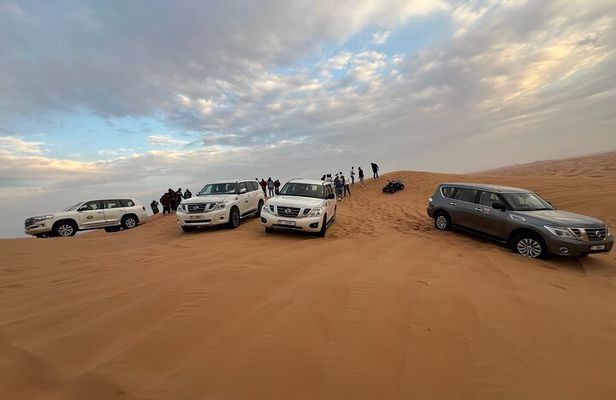 Red Dune Desert Safari Camel Ride, Sandboarding with BBQ Dinner