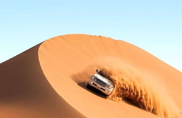 City Tour and Desert Safari with Camel Ride and Sand Boarding