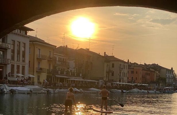 Sup experience with a ride to Peschiera del Garda Lake Garda