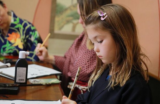 Learning Zen of Japanese Calligraphy in kimono near Osaka Castle