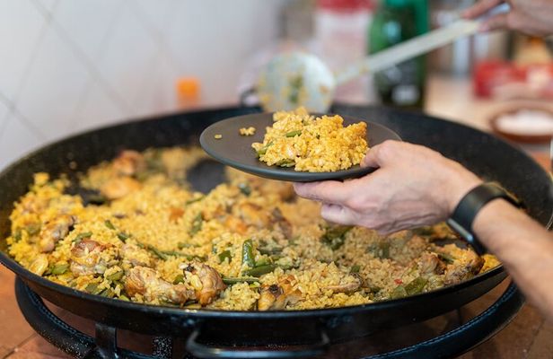 Cook your Paella with Purchase to Russafa Market in Valencia