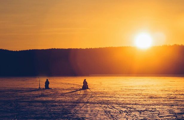 Ice Fishing Adventure in Lapland's Arctic Wilderness in Levi