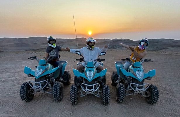 Quad biking in Agafay desert at sunset