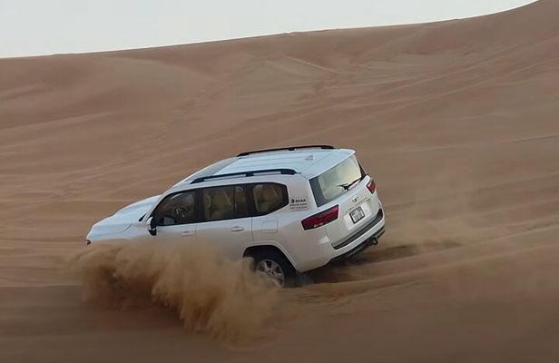 Evening Desert Safari Dubai Dune Bashing Camel Ride and BBQDinner