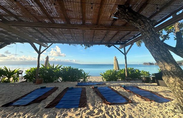Yoga at sunrise at Sofitel Moorea, overlooking Tahiti