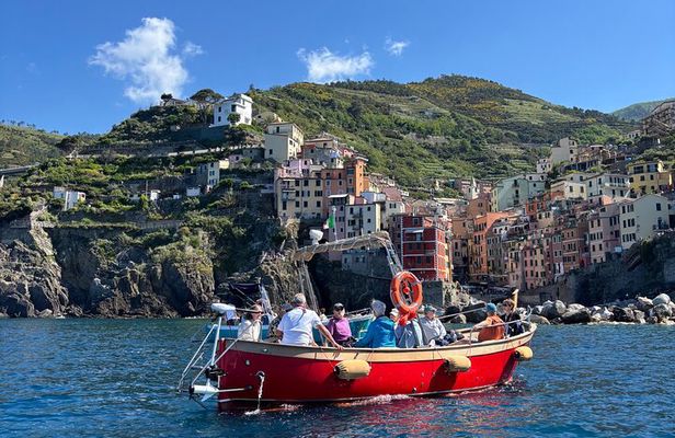 Boat ride from Riomaggiore with stop for swimming and local wine.