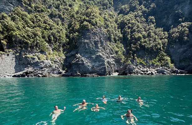 Boat ride from Riomaggiore with stop for swimming and local wine.