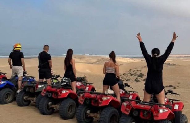 quad bike tour in the desert sand dunes
