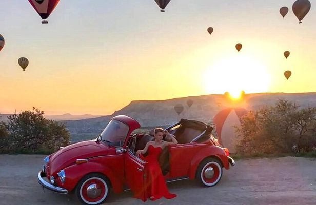 Romance on Wheels: Vintage Car Sunrise Ride with Balloon Views