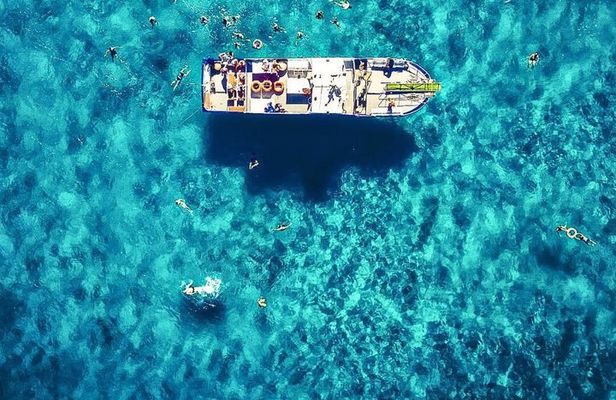 Ibiza Beach Hopper with Lunch Open Bar Paddle Surf and Snorkeling