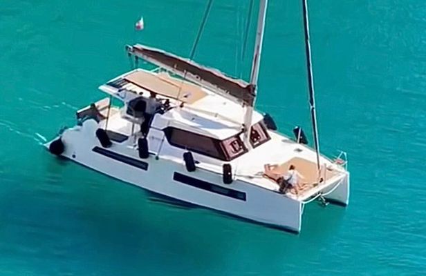 Catamaran tour stops bathing and snorkeling toast with prosecco