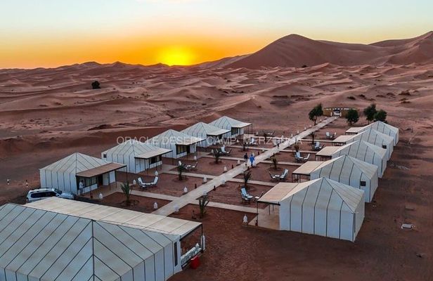 Overnight stay in luxury desert camp camel ride &sandboarding