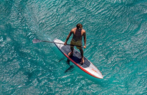 Surf Foil Lesson in Tamarind Fly over the water