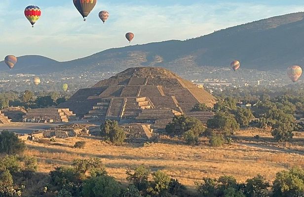Balloon sunrise over Teotihuacan and Basilica pyramids